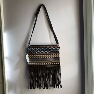 NWT Adjustable cross-body bag with fringe tassle.